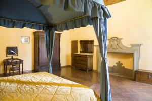 En eller flere senger på et rom på Villa Grassina