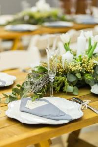 a table with a napkin and a wine glass on it at Loskop Valley Lodge in Groblersdal