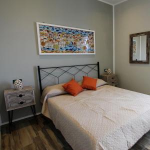 A bed or beds in a room at Case Vacanza Le Casette