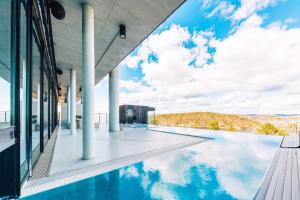a swimming pool on the side of a building at Kragerø Resort in Kragerø