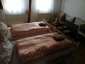 Postel nebo postele na pokoji v ubytování Pension Harmonie