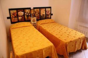 Кровать или кровати в номере Ninin Vernazza
