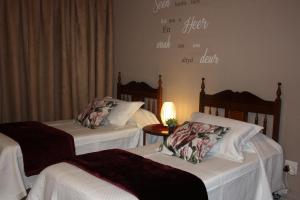 En eller flere senge i et værelse på Little Umhlanga
