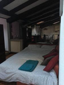 Voodi või voodid majutusasutuse Mansarda San Maurizio toas