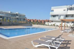 Der Swimmingpool an oder in der Nähe von New and cosy apartment - 4 min walk from the beach - La Tejita - El Medano
