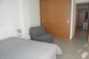 A bed or beds in a room at New and cosy apartment - 4 min walk from the beach - La Tejita - El Medano