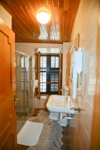 a bathroom with a sink and a shower and a toilet at Hotel Marija in Kotor