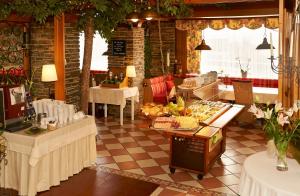 a restaurant with a table with food on it at Pension Ebnerwirt in Eben im Pongau