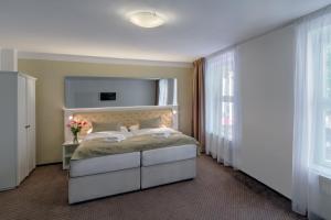 Cama o camas de una habitación en Hotel Taurus
