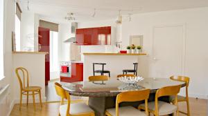 a kitchen and dining room with a table and chairs at Little Suite - Théo in Lille +10 photos
