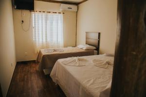 Katil atau katil-katil dalam bilik di Pousada Café da Roça