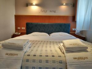 Tempat tidur dalam kamar di Hotel Park Central