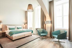 Un pat sau paturi într-o cameră la Boutique Residence Budapest
