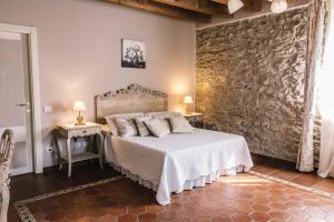 Postel nebo postele na pokoji v ubytování B&B - Relais de charme la Caminella