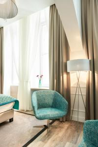 A bed or beds in a room at Boutique Residence Budapest