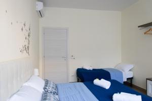 Postel nebo postele na pokoji v ubytování Melibi - Re Lear Apartments