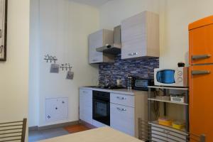 Kuchyň nebo kuchyňský kout v ubytování Melibi - Re Lear Apartments