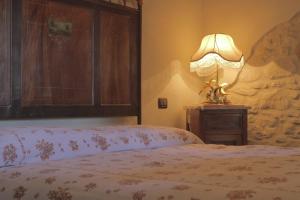 Postel nebo postele na pokoji v ubytování Agriturismo Portoreschi
