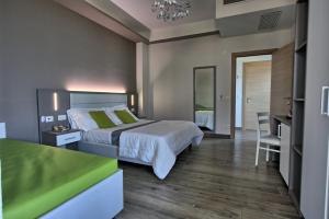 Postel nebo postele na pokoji v ubytování GFH - Hotel Sole Resort & Spa