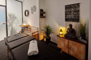 a meditation room with a buddha sitting on a table at Hotel Memories OldTown in Budapest