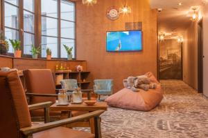 a room with a teddy bear sitting on a pillow at Hotel Memories OldTown in Budapest