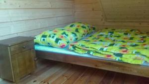 Posteľ alebo postele v izbe v ubytovaní Domek u Charnasia