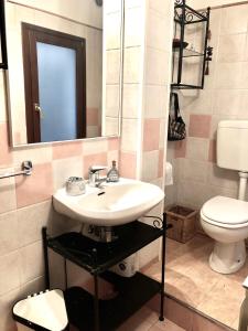 a bathroom with a sink and a toilet at Romantic Venice in Venice