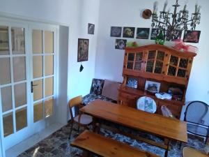 a dining room with a wooden table and chairs at Casa del Monte in Antonelli