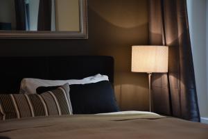Postel nebo postele na pokoji v ubytování Boutique-Hotel Antica Posta
