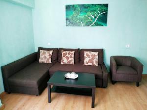 a living room with a couch and a chair and a table at Apartment in Valencia in Valencia