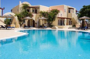 a large swimming pool in front of a building at Smaragdi in Perivolos