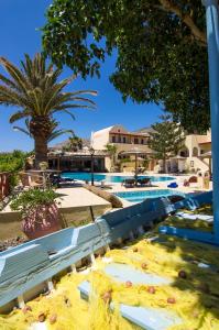 a water slide in a resort with palm trees at Smaragdi in Perivolos