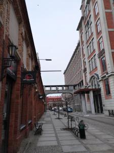 an empty street in a city with buildings at LoftStyle Apartament in Żyrardów