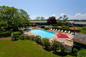 an overhead view of a swimming pool with chairs and umbrellas at Seaglass Inn Provincetown in Provincetown
