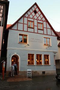 two people standing in the doorway of a building at Lauchertstüble in Veringenstadt