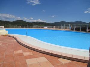a large blue swimming pool on top of a building at Bastidon "Capitou" in Fréjus