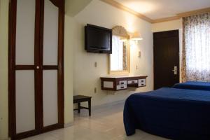 Cama o camas de una habitación en Hotel Sands Arenas