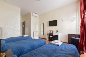 Posteľ alebo postele v izbe v ubytovaní Roma Enrico Guesthouse