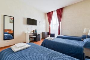 Posteľ alebo postele v izbe v ubytovaní Roma Enrico Guesthouse