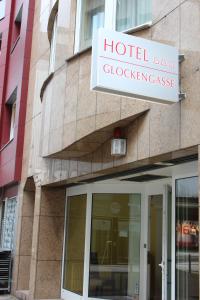 a building with a sign on the side of it at Hotel Glockengasse in Cologne