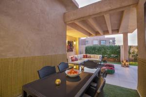 an outdoor patio with a table and chairs at Chez Maya in Marrakesh