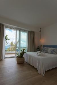 Postel nebo postele na pokoji v ubytování Zabbàra B&B