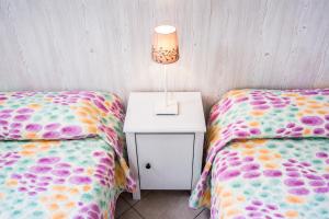 A bed or beds in a room at La Casa di Linda