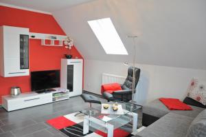 O zonă de relaxare la Ferienhaus Müritzidyll / OG-Appartement