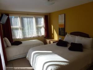 Krevet ili kreveti u jedinici u okviru objekta The Lazy Cow Accommodation