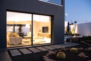 a house with a view of a living room at Sunrise Chalet Casilla de Costa in La Oliva