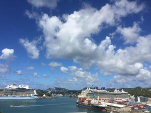 two cruise ships are docked in a harbor at Harbour Vista Inn in Castries
