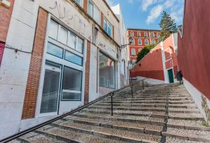 a set of stairs in front of a building at Casa Bonecos Rebeldes in Lisbon