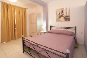 מיטה או מיטות בחדר ב-Minas Apartments