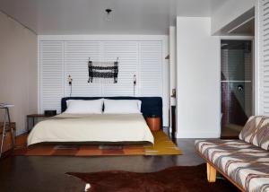 A bed or beds in a room at Ace Hotel and Swim Club Palm Springs